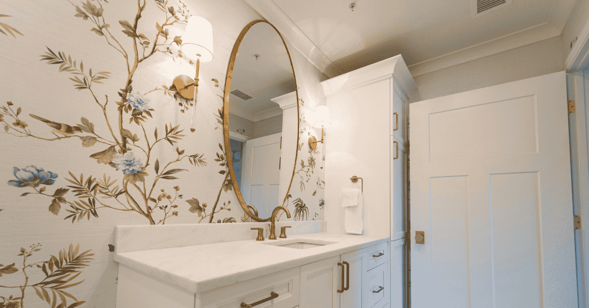 Modern bathroom with an elegant wallpaper feature wall and wood vanity