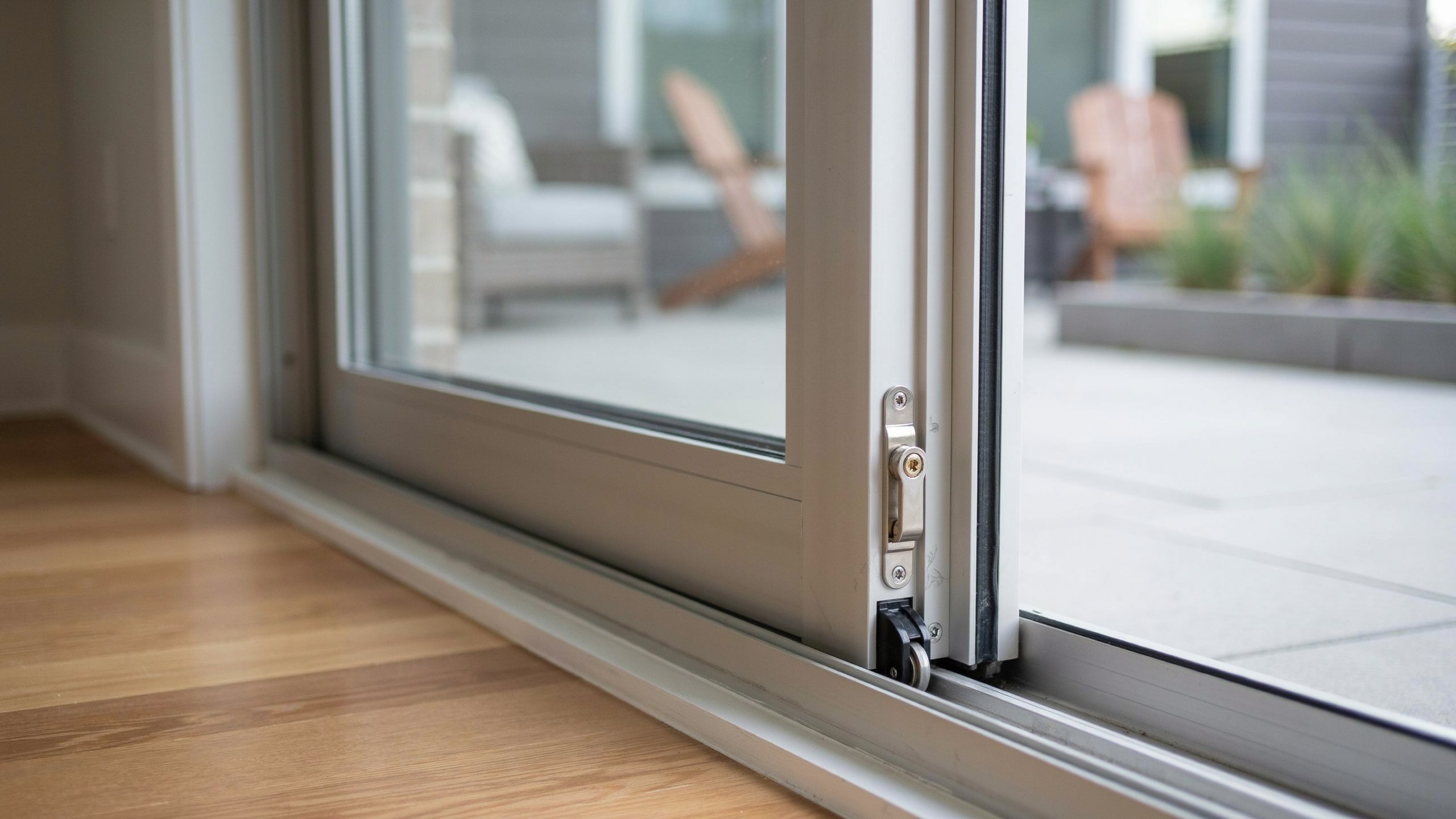 Secondary pin lock installed on a sliding glass door frame for added security